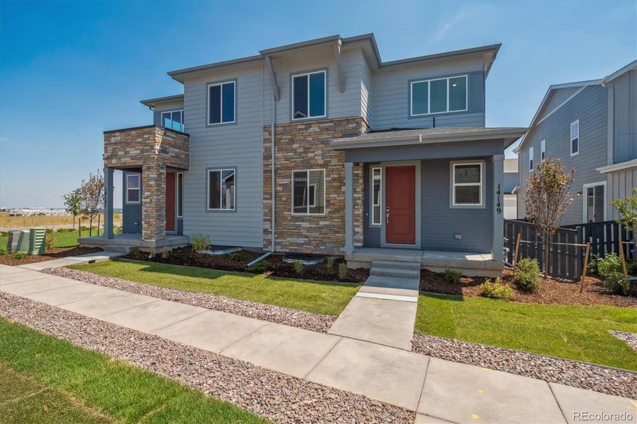 Front exterior of a new home in Paired Homes at Alder Creek, Parker, CO, highlighting curb appeal (Image 2). Front exterior of a new home in Paired Homes at Alder Creek, Parker, CO, highlighting curb appeal (Image 2).