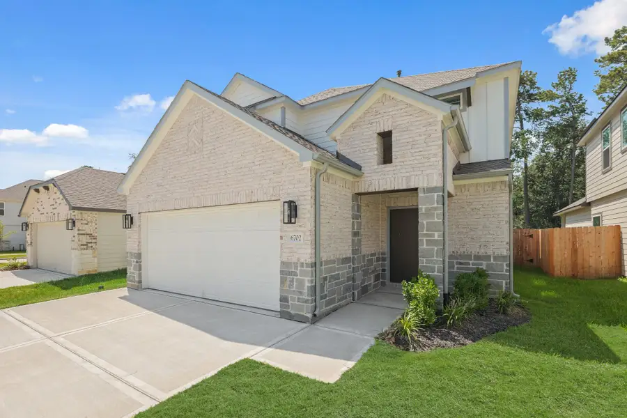 Front exterior of a new home in Cypresswood Landing, Humble, TX, highlighting curb appeal (Image 2).