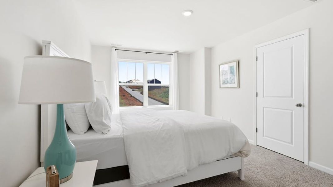 Furnished interior view inside a new home in Tanglewood Townes, Greenville (Image 28).