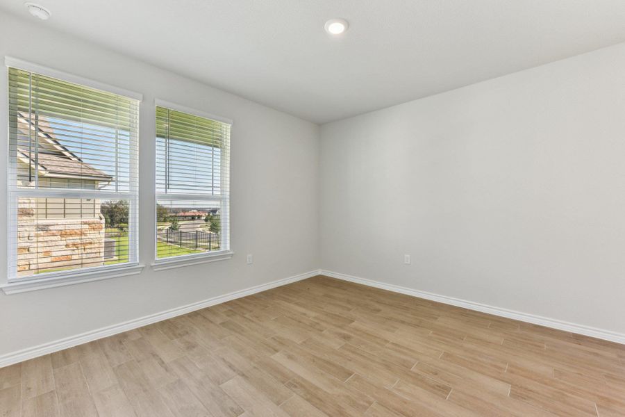 Empty room featuring recessed lighting and light wood-type flooring