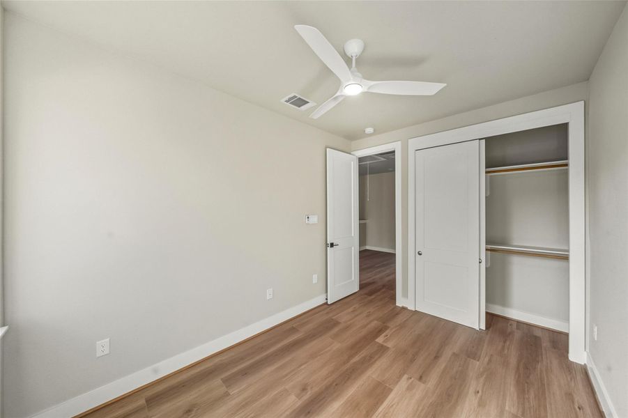 Charming secondary bedroom featuring a spacious closet, perfect for your storage needs.