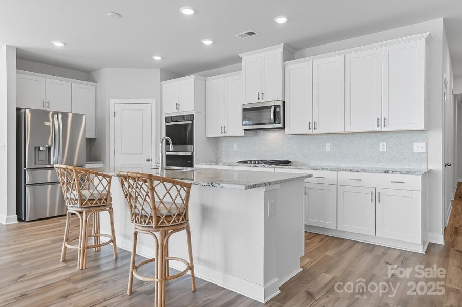 Furnished interior view inside a new home in Solena at the Vineyards II, Charlotte (Image 4). Furnished interior view inside a new home in Solena at the Vineyards II, Charlotte (Image 4).