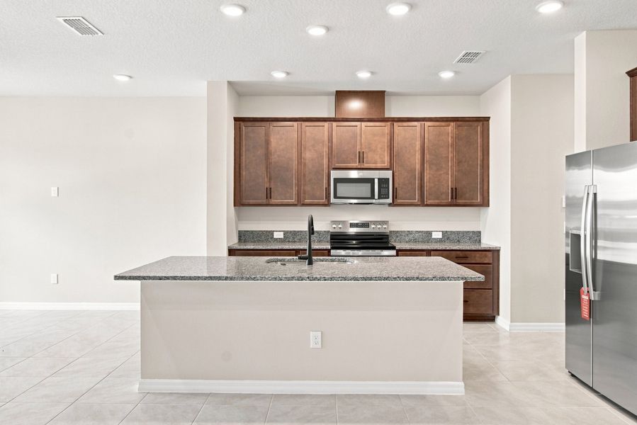 Furnished interior view inside a new home in Palmeras at Crossprairie – The Palms Collection, St. Cloud (Image 5).