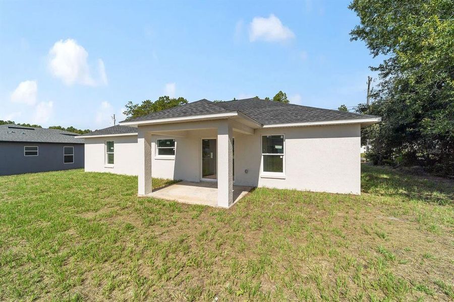 Front exterior of a new home in , Ocala, FL, highlighting curb appeal (Image 12).