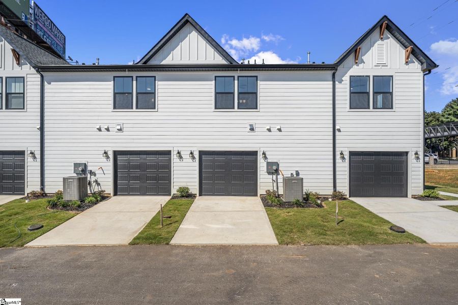Front exterior of a new home in Renaissance Place, Greenville, SC, highlighting curb appeal (Image 2). Front exterior of a new home in Renaissance Place, Greenville, SC, highlighting curb appeal (Image 2).