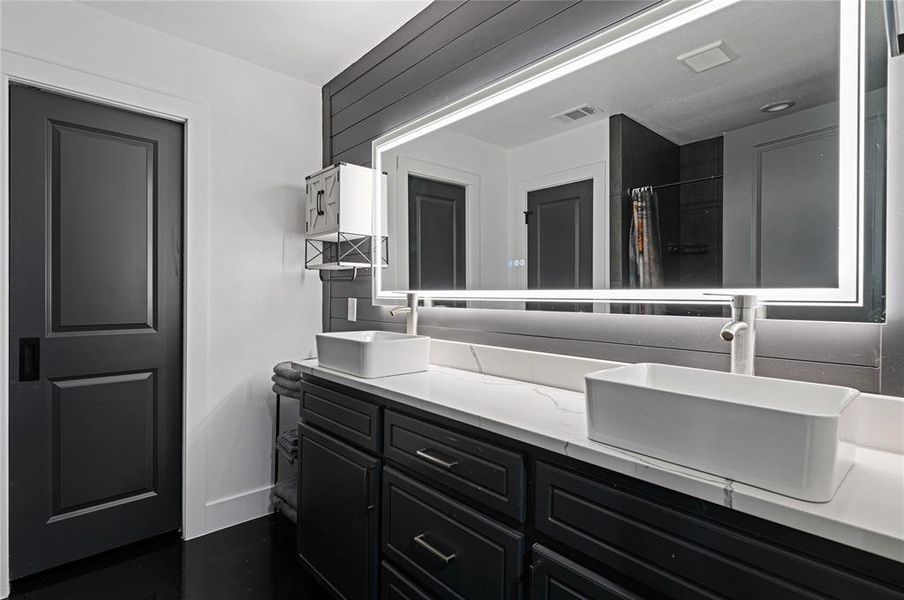 Bathroom with walk in shower and vanity