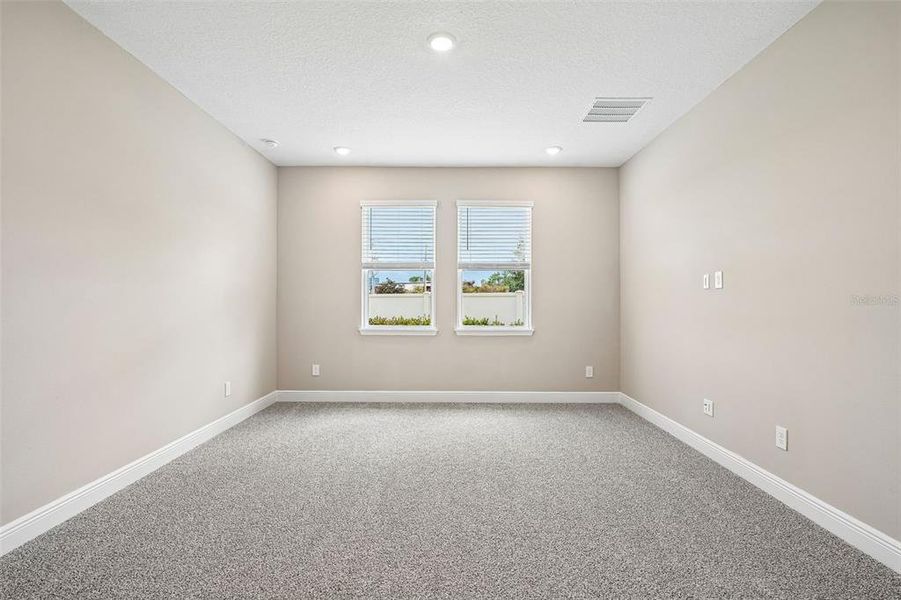 Spacious, unfurnished interior of a new home in Legends Preserve - Signature Series, Daytona Beach (Image 22).