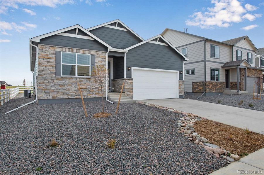 Front exterior of a new home in Ridge at Johnstown, Johnstown, CO, highlighting curb appeal (Image 2).