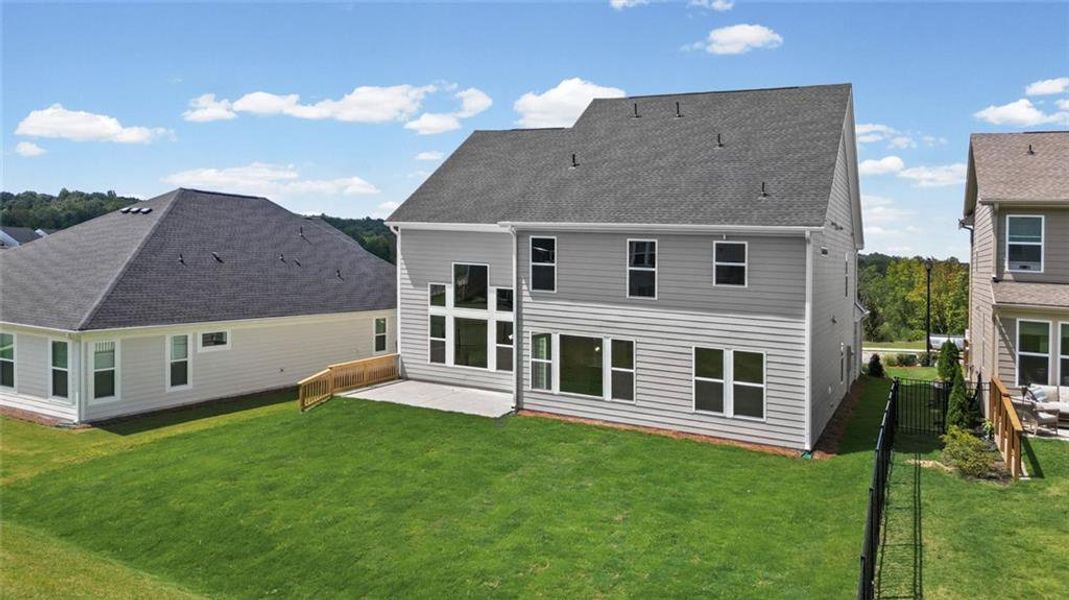 Exterior details and patio area of a home in Twin Lakes, Hoschton (Image 29).