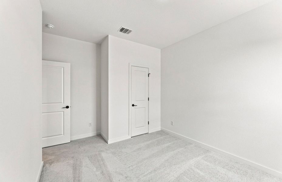 Representative unfurnished interior of a home built from the Elliott by Pulte Homes in West Cypress Hills, Spicewood (Image 25).