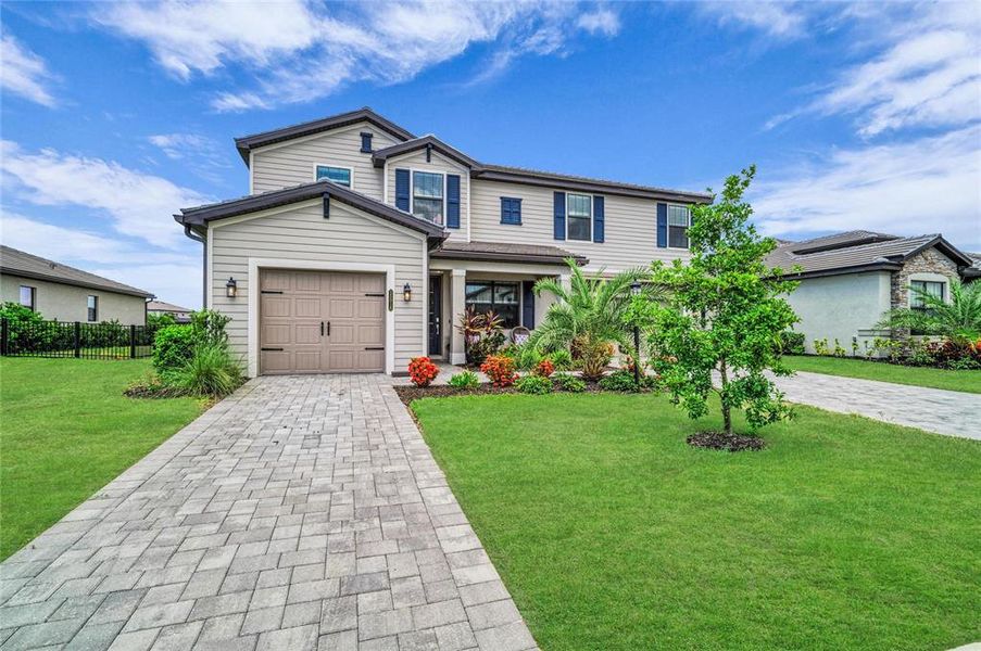 Front exterior of a new home in , Lakewood Ranch, FL, highlighting curb appeal (Image 25).