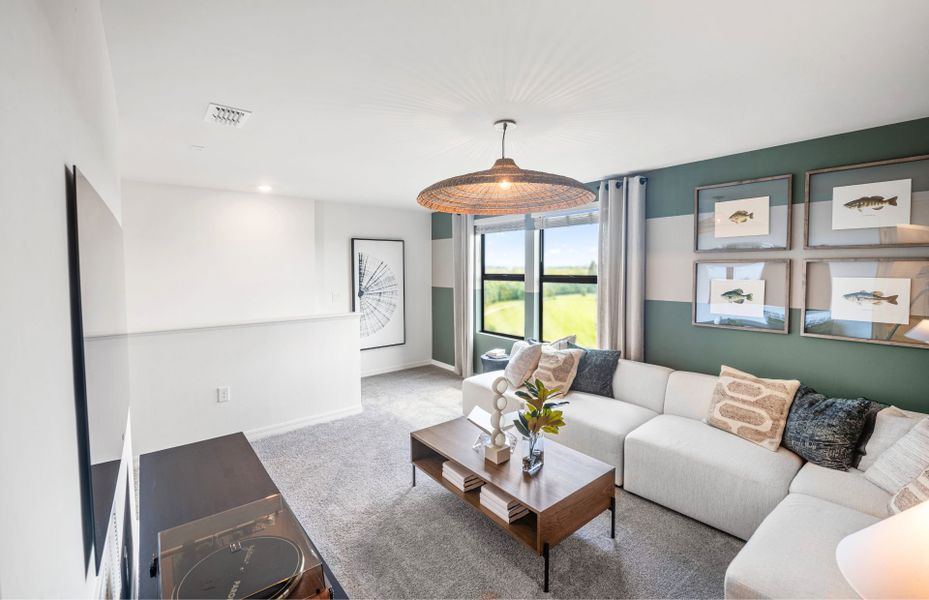 Representative furnished interior of a home built from the McNair by Centex in Whispering Lakes, Lehigh Acres (Image 7).