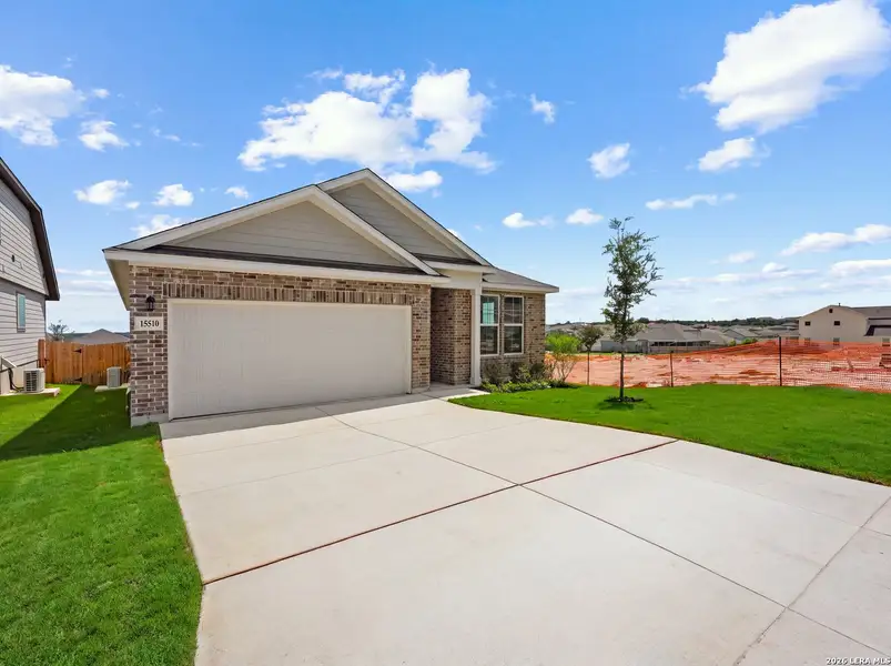 Front exterior of a new home in Hunter's Ranch, San Antonio, TX, highlighting curb appeal (Image 1). Front exterior of a new home in Hunter's Ranch, San Antonio, TX, highlighting curb appeal (Image 1).