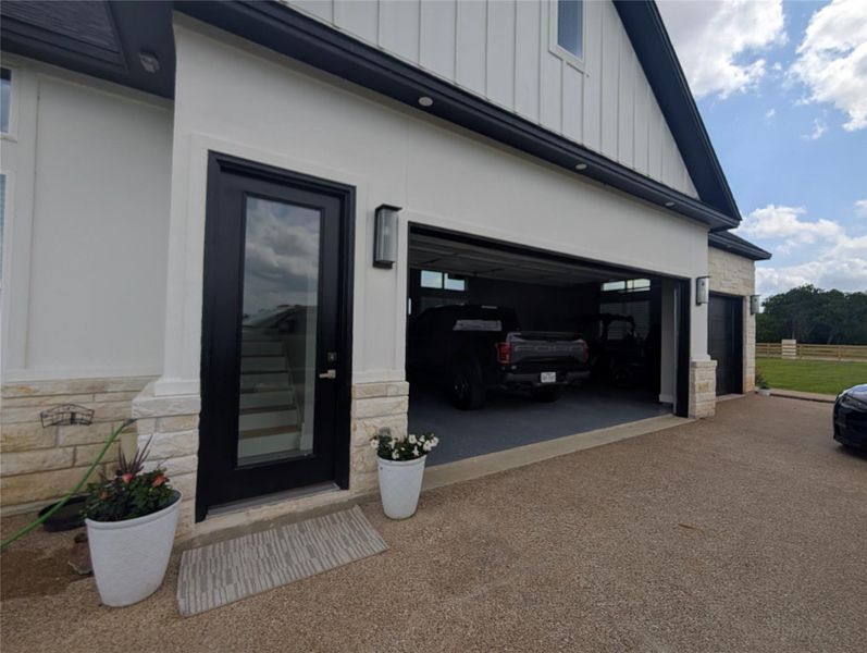 3 car garage with a walk through entry that leads to the only room located upstairs.  The bonus room.