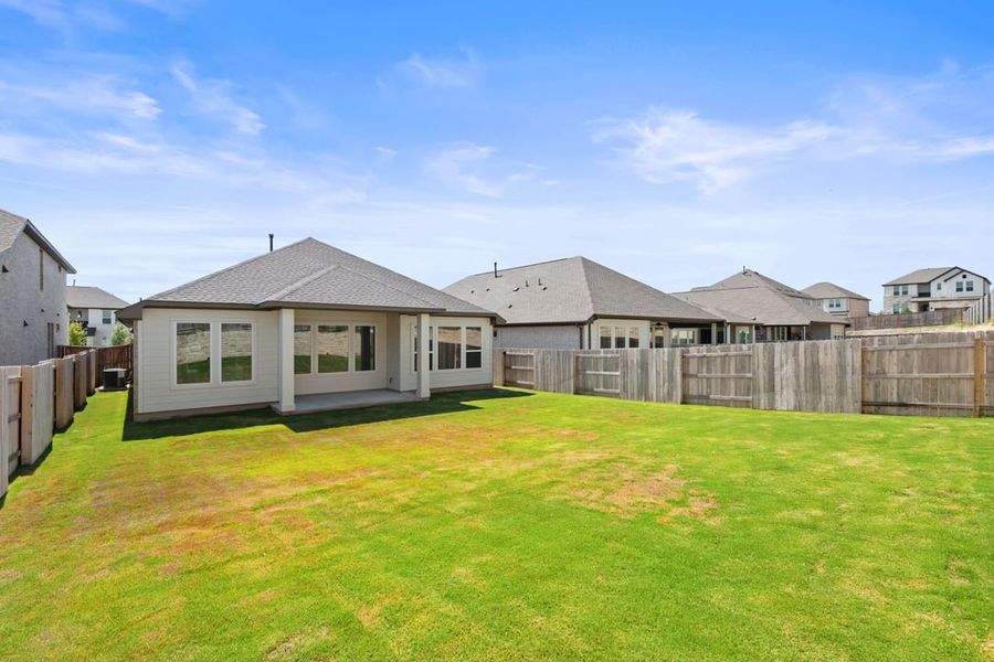 Front exterior of a new home in Park Collection at Lariat, Liberty Hill, TX, highlighting curb appeal (Image 26). Front exterior of a new home in Park Collection at Lariat, Liberty Hill, TX, highlighting curb appeal (Image 26).
