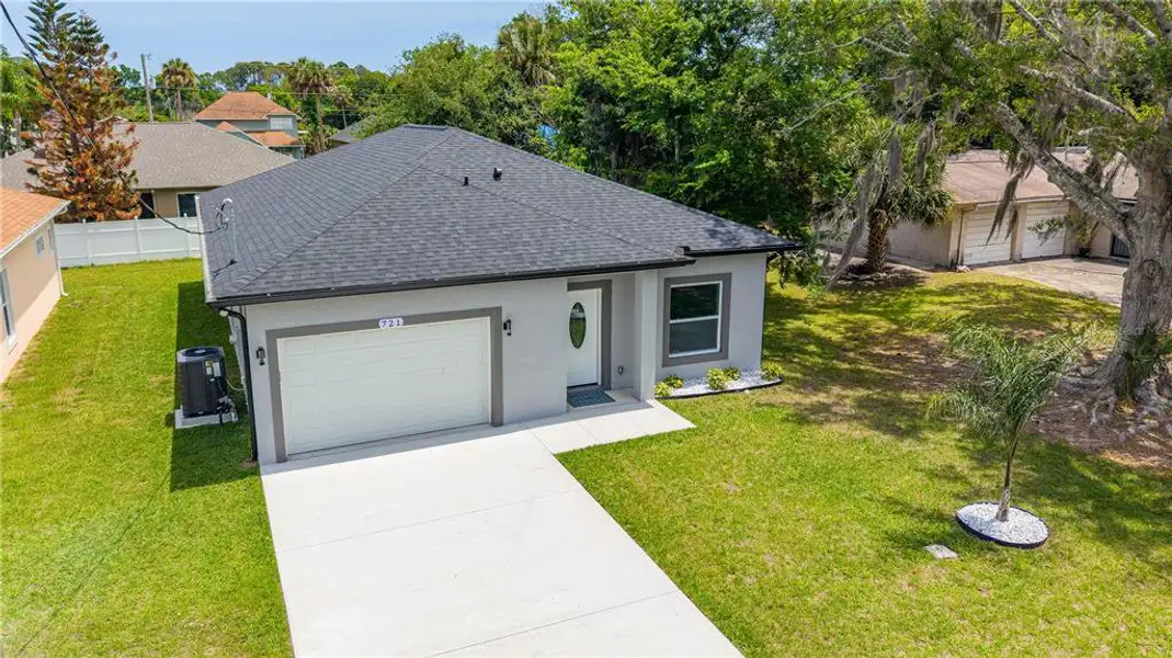 Front exterior of a new home in , Daytona Beach, FL, highlighting curb appeal (Image 1). Front exterior of a new home in , Daytona Beach, FL, highlighting curb appeal (Image 1).