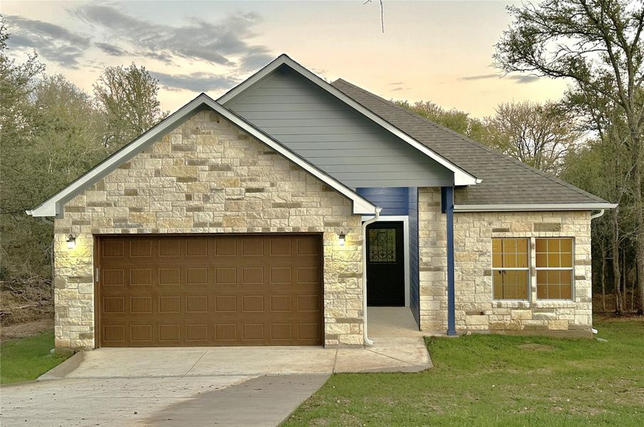 Front exterior of a new home in , Bastrop, TX, highlighting curb appeal (Image 1). Front exterior of a new home in , Bastrop, TX, highlighting curb appeal (Image 1).