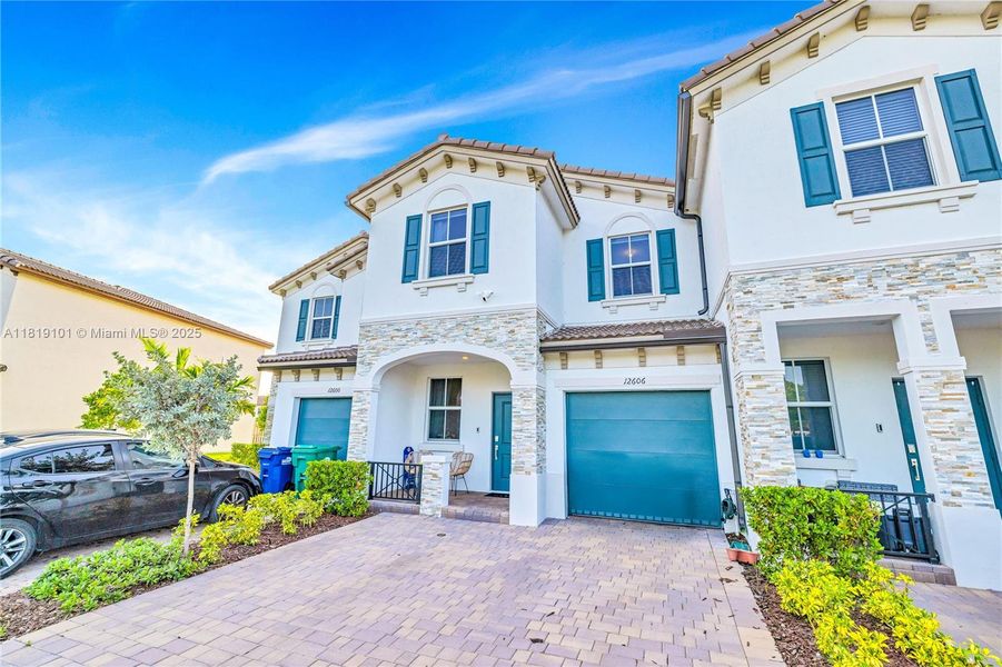 Front exterior of a new home in Westview: Nantucket Collection, Miami, FL, highlighting curb appeal (Image 25). Front exterior of a new home in Westview: Nantucket Collection, Miami, FL, highlighting curb appeal (Image 25).