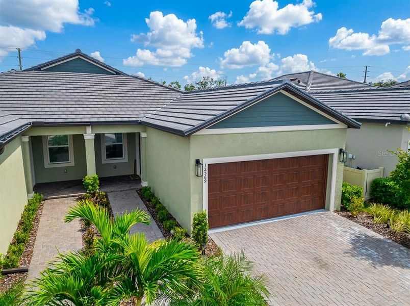 Front exterior of a new home in , Parrish, FL, highlighting curb appeal (Image 25).