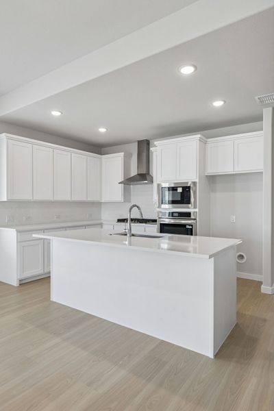 Kitchen in the Stanley II home plan by Trophy Signature Homes – REPRESENTATIVE PHOTO
