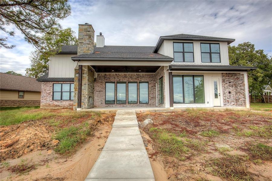 Front exterior of a new home in , Gun Barrel City, TX, highlighting curb appeal (Image 20). Front exterior of a new home in , Gun Barrel City, TX, highlighting curb appeal (Image 20).