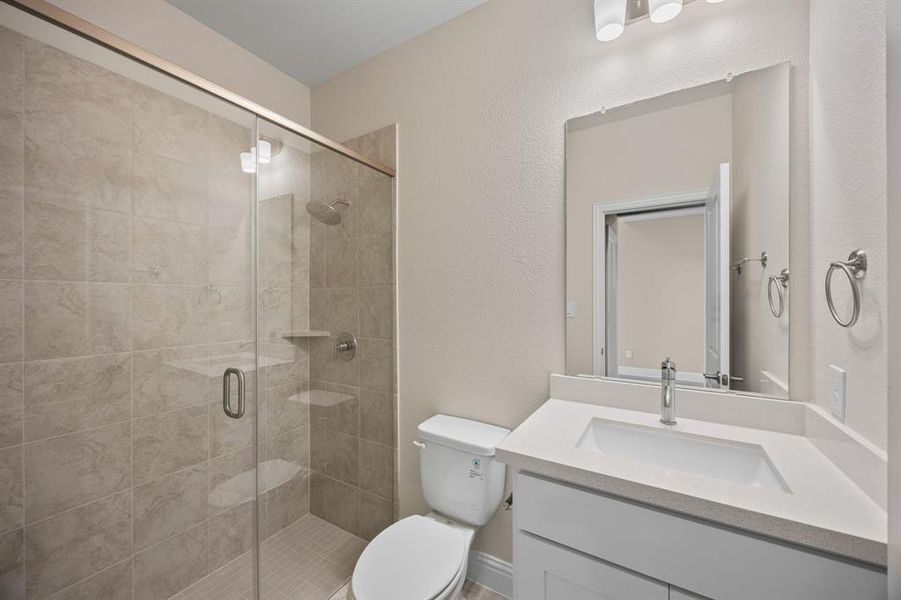 1st floor guest Bathroom featuring a walk in shower.