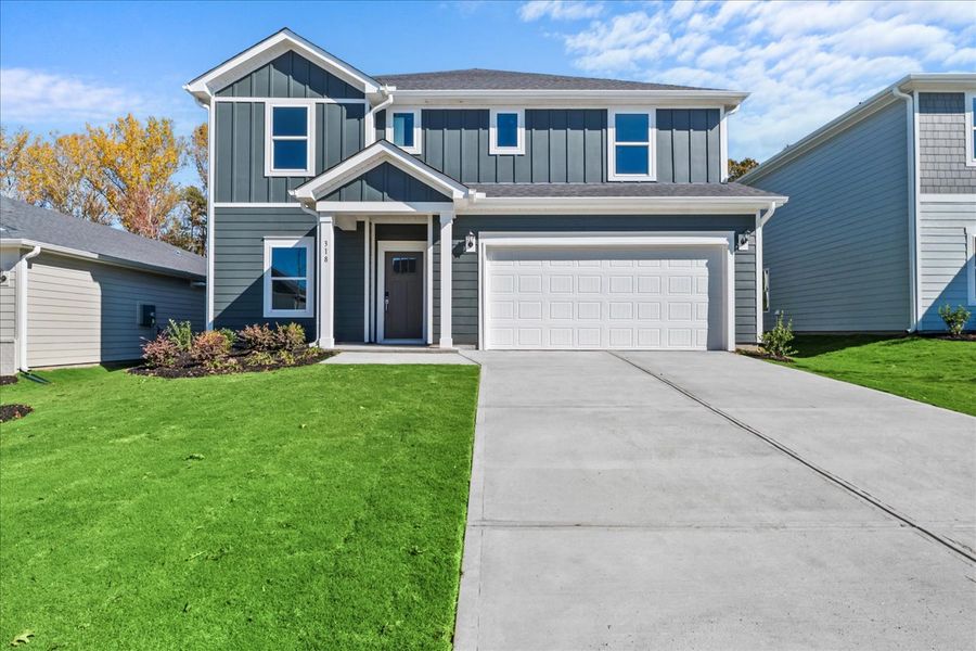 Front exterior of a new home in Riverwood Farm, Piedmont, SC, highlighting curb appeal (Image 1). Front exterior of a new home in Riverwood Farm, Piedmont, SC, highlighting curb appeal (Image 1).