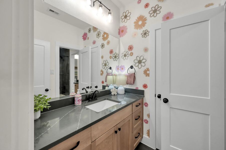 Hall vanity serving the detached secondary bedrooms, providing added space and convenience.