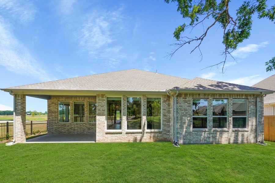 Outdoor living at is best is found here! The covered back Porch is inset into the home and immersed in brick. The exposure is perfect to catch the prevailing southeaster breeze that cools on hot summer days.