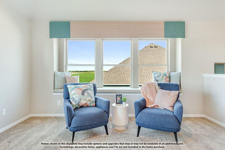Two blue accent chairs with decorative pillows beside a large triple window with outdoor views and carpet flooring Two blue accent chairs with decorative pillows beside a large triple window with outdoor views and carpet flooring