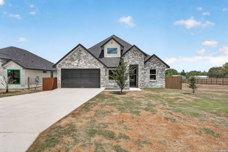 Front exterior of a new home in , Somerset, TX, highlighting curb appeal (Image 23).
