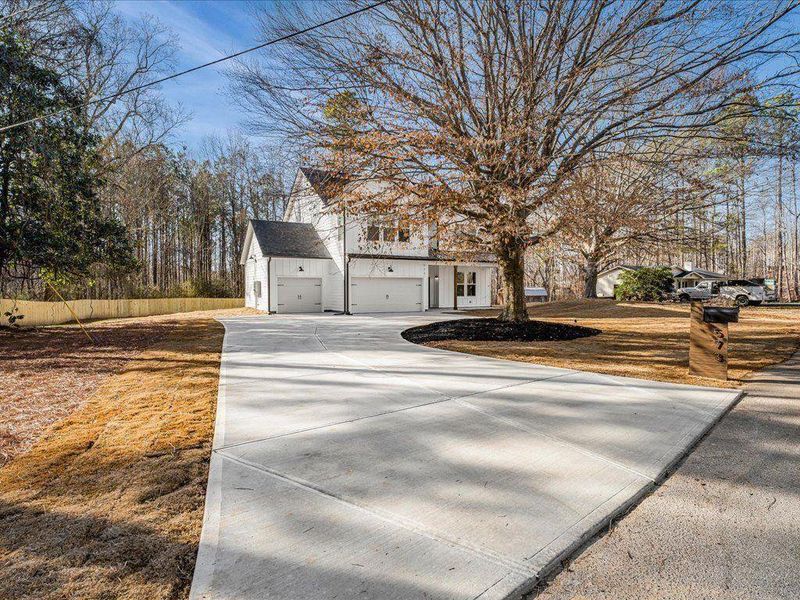 Front exterior of a new home in , Dallas, GA, highlighting curb appeal (Image 2). Front exterior of a new home in , Dallas, GA, highlighting curb appeal (Image 2).