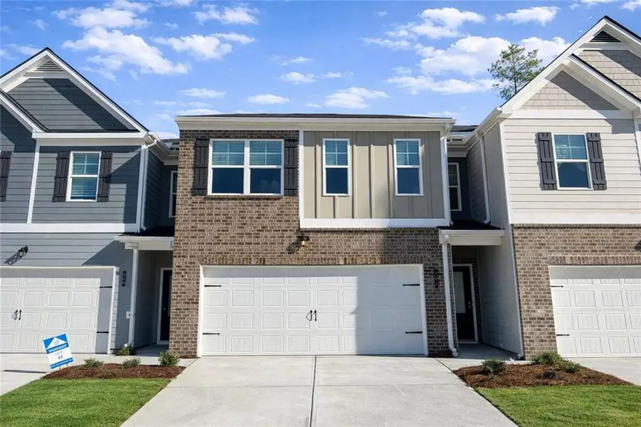 Front exterior of a new home in The Enclave at Whitewater Creek, Union City, GA, highlighting curb appeal (Image 1). Front exterior of a new home in The Enclave at Whitewater Creek, Union City, GA, highlighting curb appeal (Image 1).
