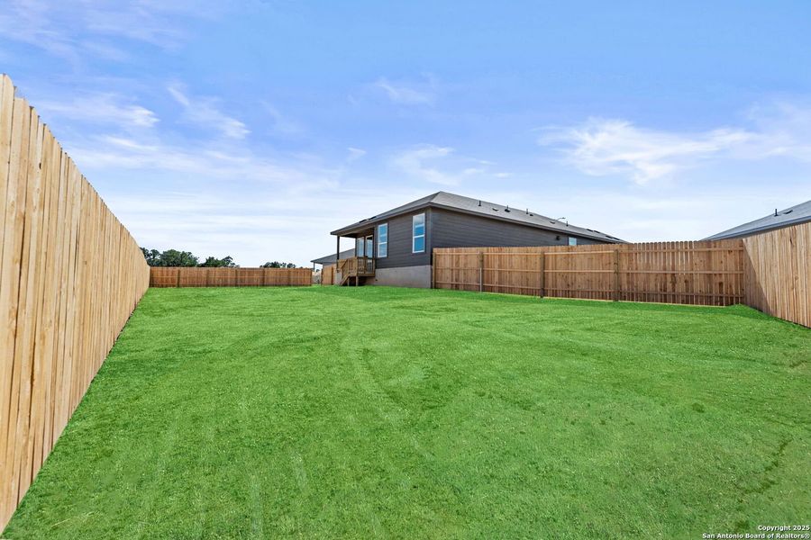 Front exterior of a new home in Waterwheel: Coastline Collection, San Antonio, TX, highlighting curb appeal (Image 1).