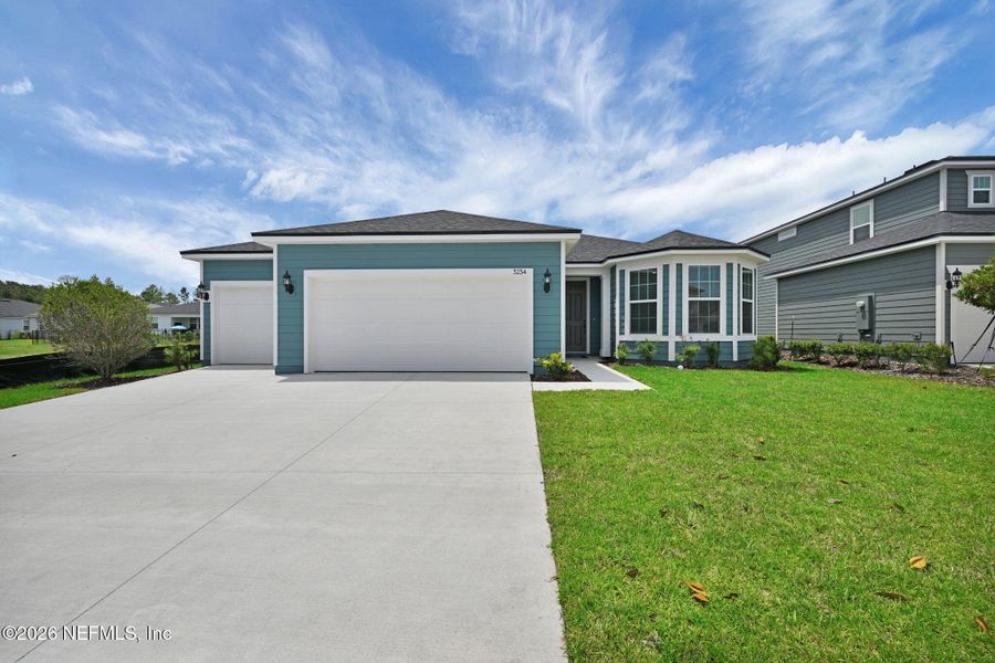Front exterior of a new home in Hyland Trail, Green Cove Springs, FL, highlighting curb appeal (Image 29).