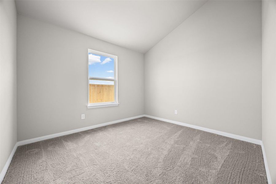 Vaulted ceilings and plush carpeting define this versatile secondary bedroom space. Vaulted ceilings and plush carpeting define this versatile secondary bedroom space.
