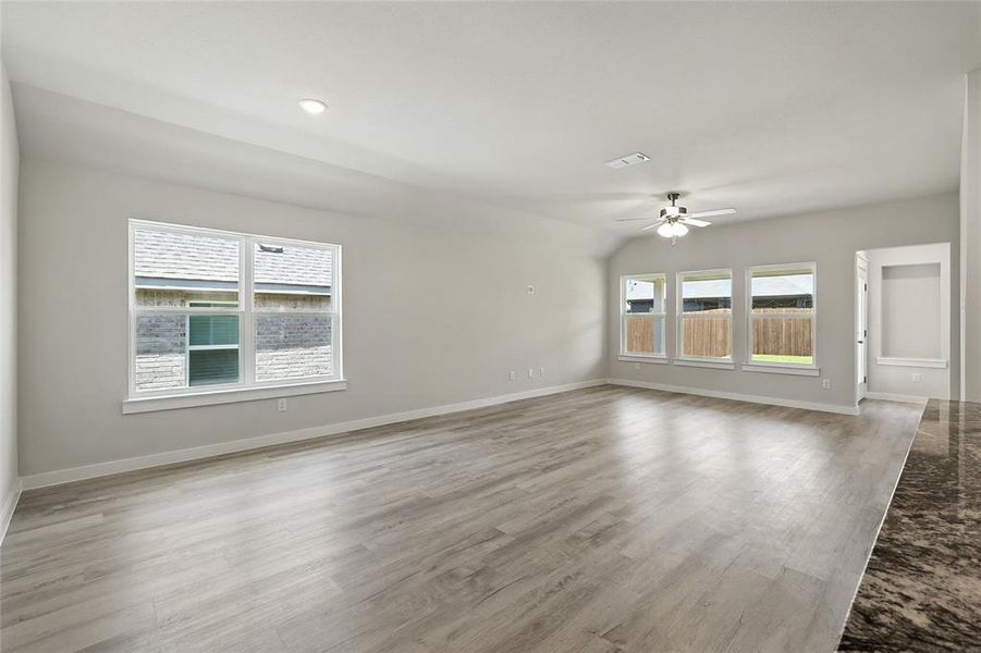 Spare room featuring a ceiling fan and light wood-style floors