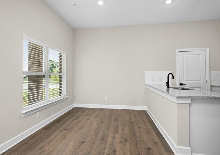 The dining area has large windows that let in great, natural light.