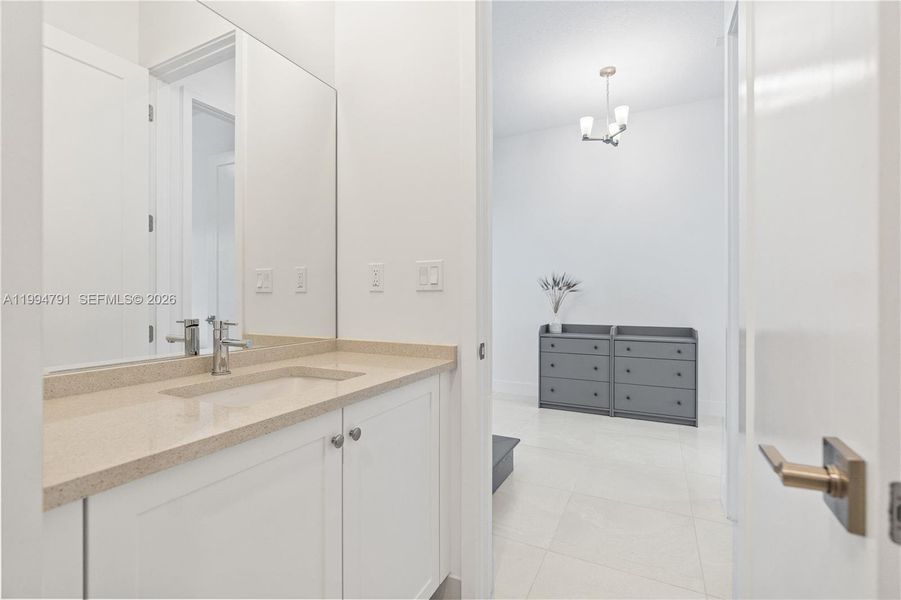 Guest half bath off foyer