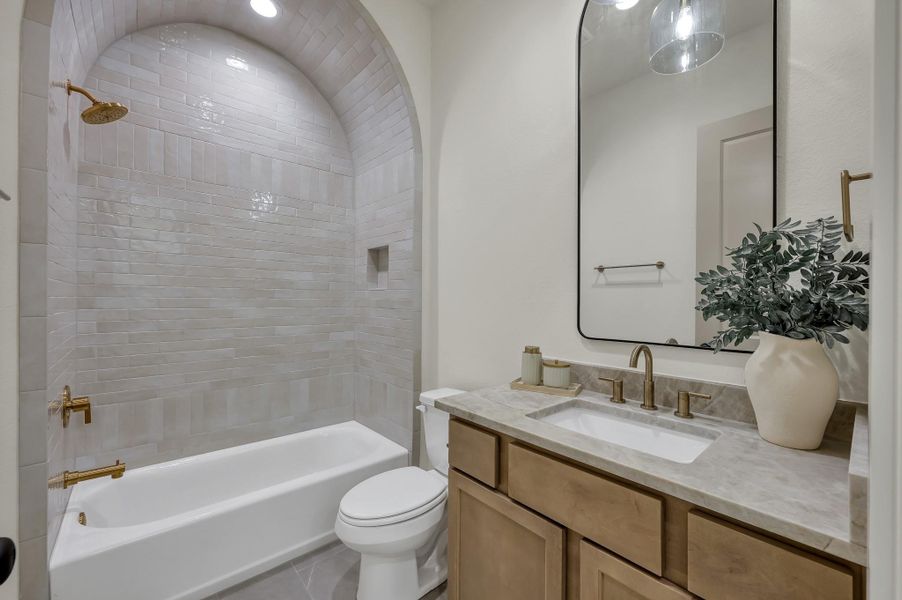 Secondary bathroom with unique tiled archway Secondary bathroom with unique tiled archway