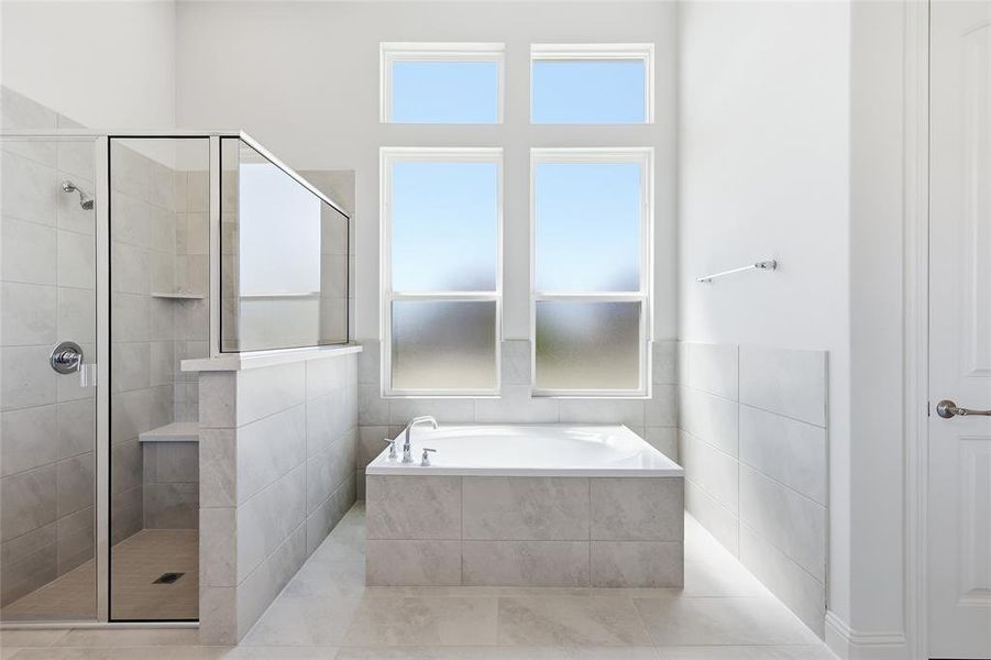 Full bathroom featuring a stall shower and a bath