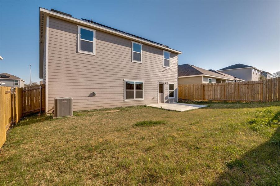 Back of property with a patio and a fenced backyard