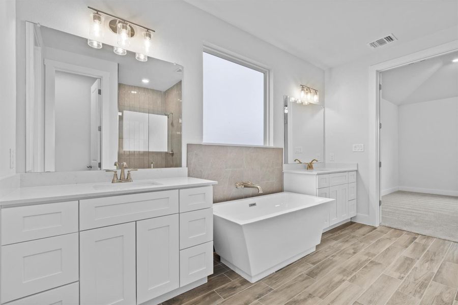 Bathroom with vanity and plus walk in shower