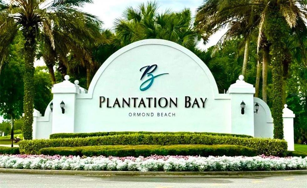 Front exterior of a new home in Westlake Townhomes, Ormond Beach, FL, highlighting curb appeal (Image 17).