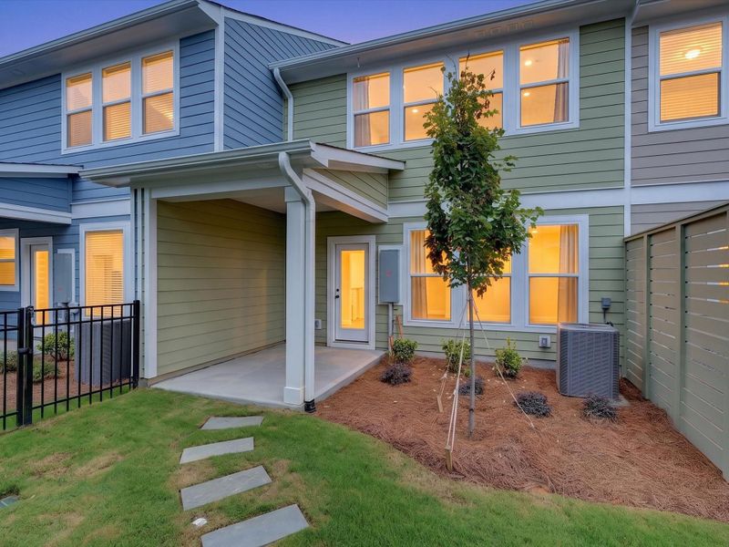 Exterior details and patio area of a home in North Creek Village - Townhomes, Huntersville (Image 3).