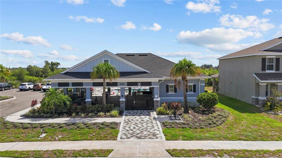 Front exterior of a new home in Evergreen, Bradenton, FL, highlighting curb appeal (Image 21).