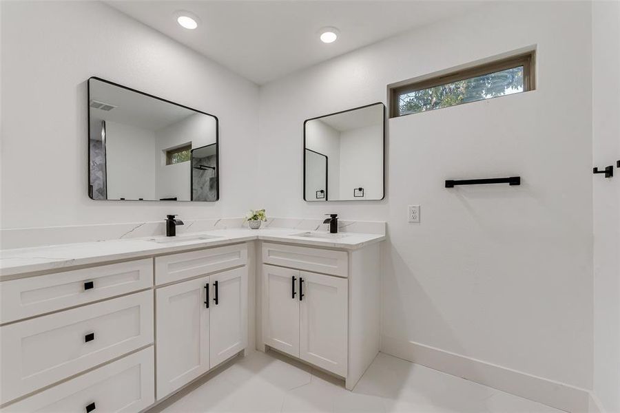 Bathroom with vanity and tile patterned flooring