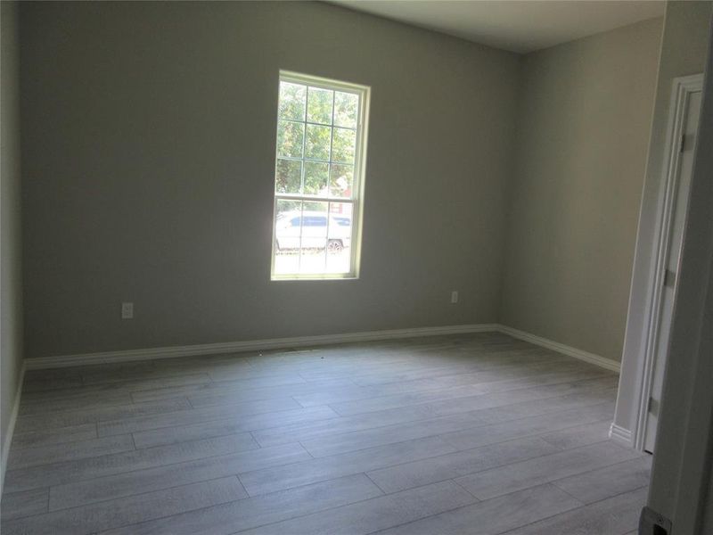 Unfurnished room with wood-type flooring