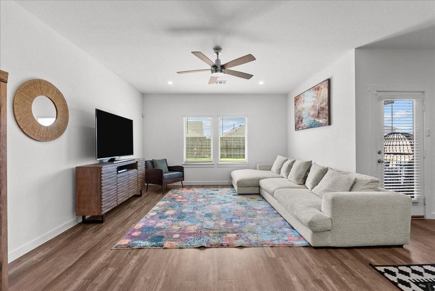 Open-concept design flows seamlessly into the spacious family room and dining area, making entertaining easy.