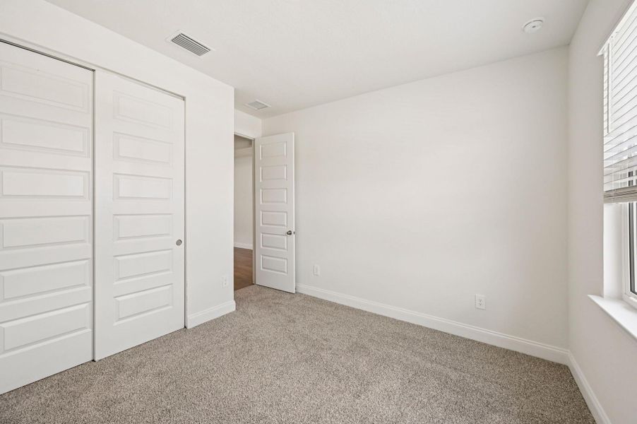 Spacious, unfurnished interior of a new home in Hampton Park - Signature Series, Vero Beach (Image 22).